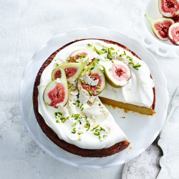 overhead-view-of-orange-and-almond-cake-with-yoghurt-cream-pistachios-figs-and-cake-server-e1665052593385-pvt7b8srrdqx5vosguc8b88xrhvu14kb3agz28xisw